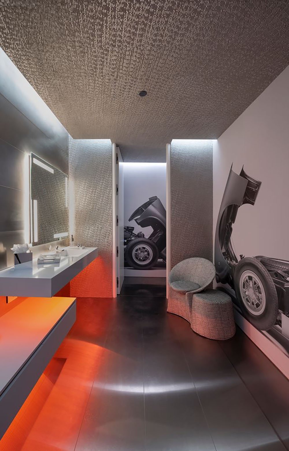 A modern home with a water feature and a movie screen.