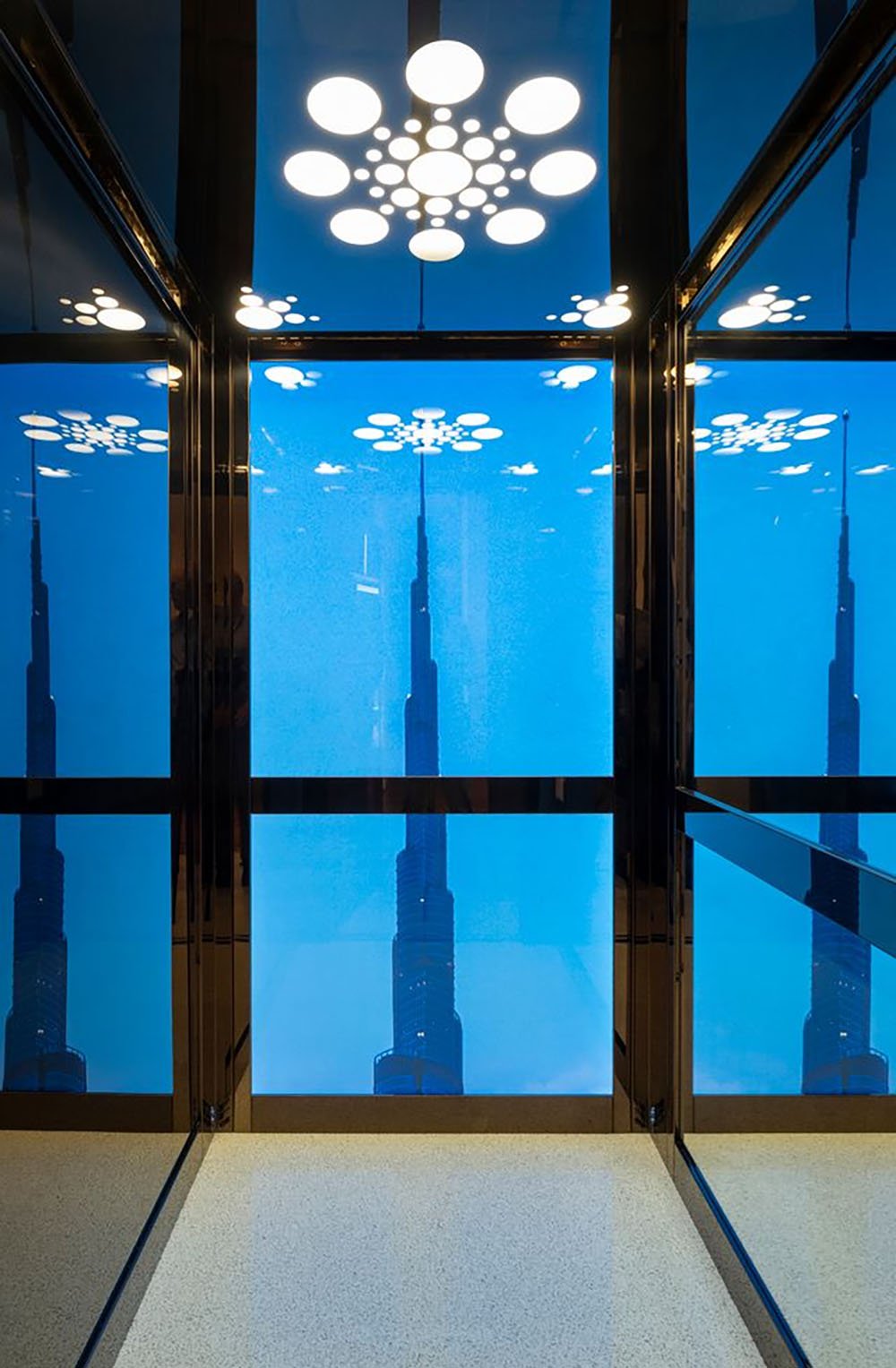 A home elevator with a backlit mural of the Burj Khalifa, in Dubai, UAE.
