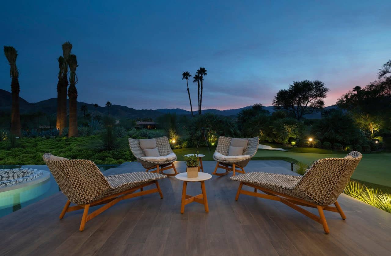 modern luxury house exterior with a patio at dusk