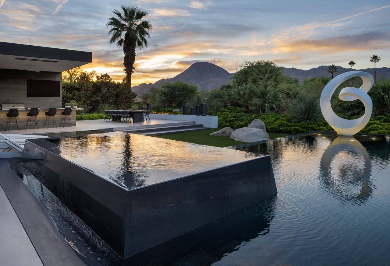 modern luxury house exterior with a pool at dusk