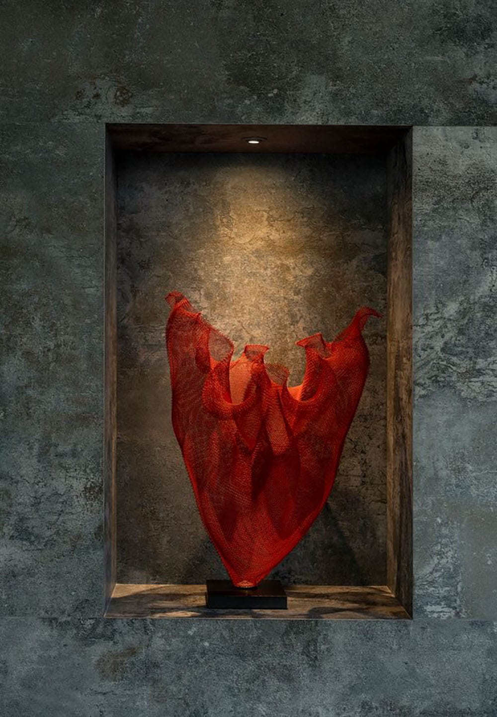 modern dining room with a niche art display