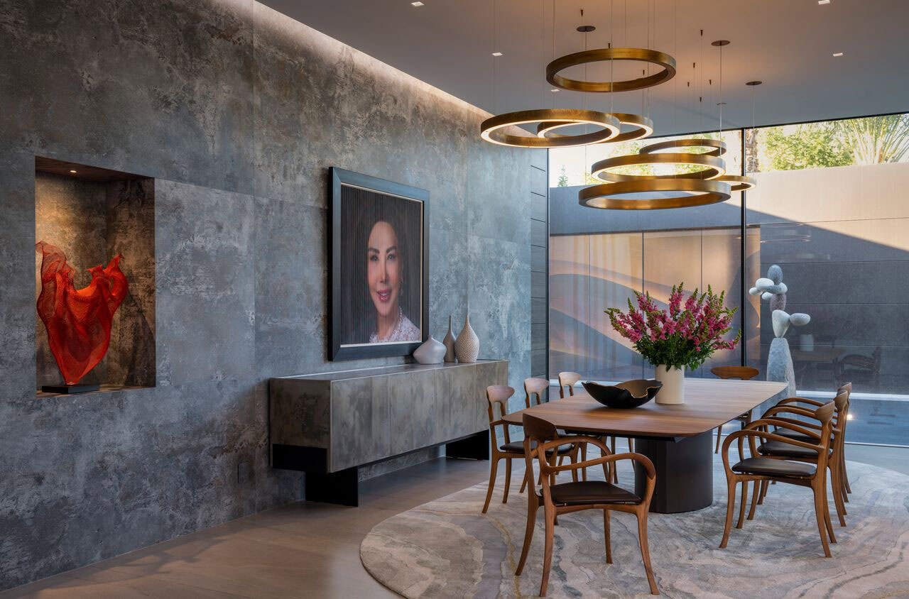modern dining room with a large chandelier