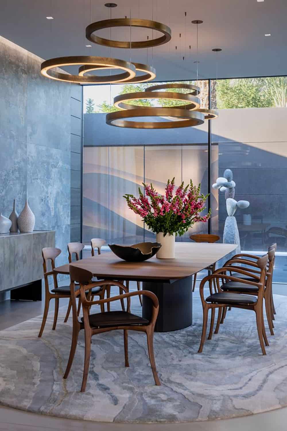 modern dining room with a large chandelier