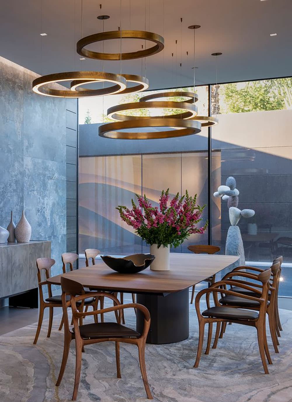 modern dining room with a large chandelier