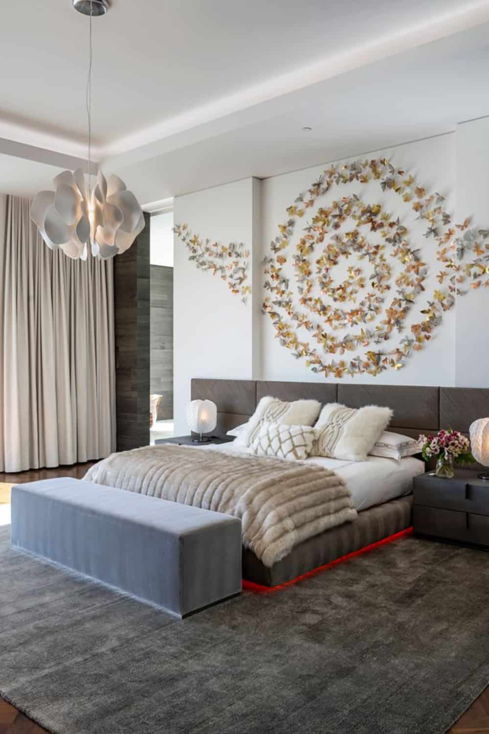 modern bedroom with a wall art installation