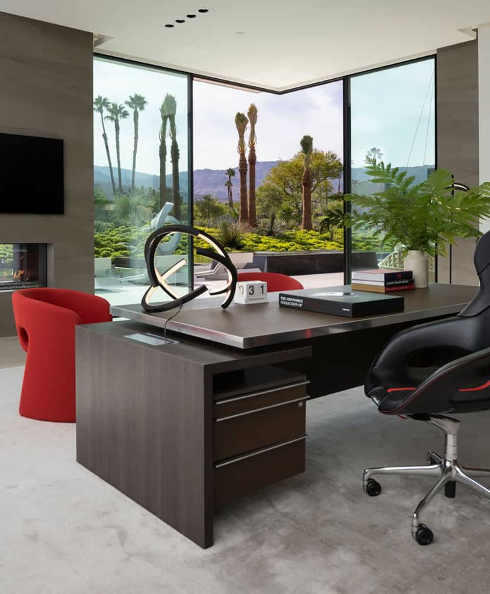 Modern office with a large window and a desk.