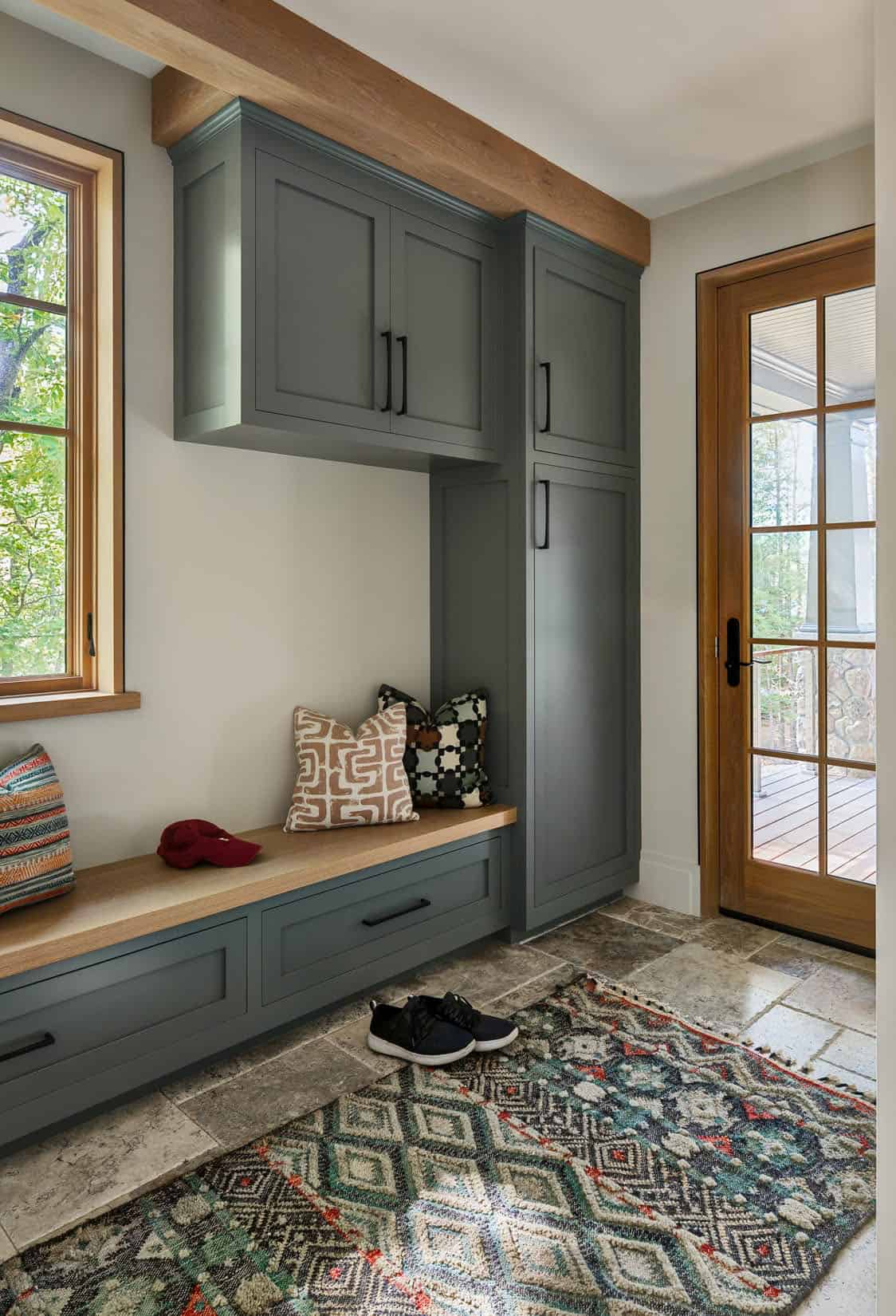rustic mudroom entry with a built-in bench