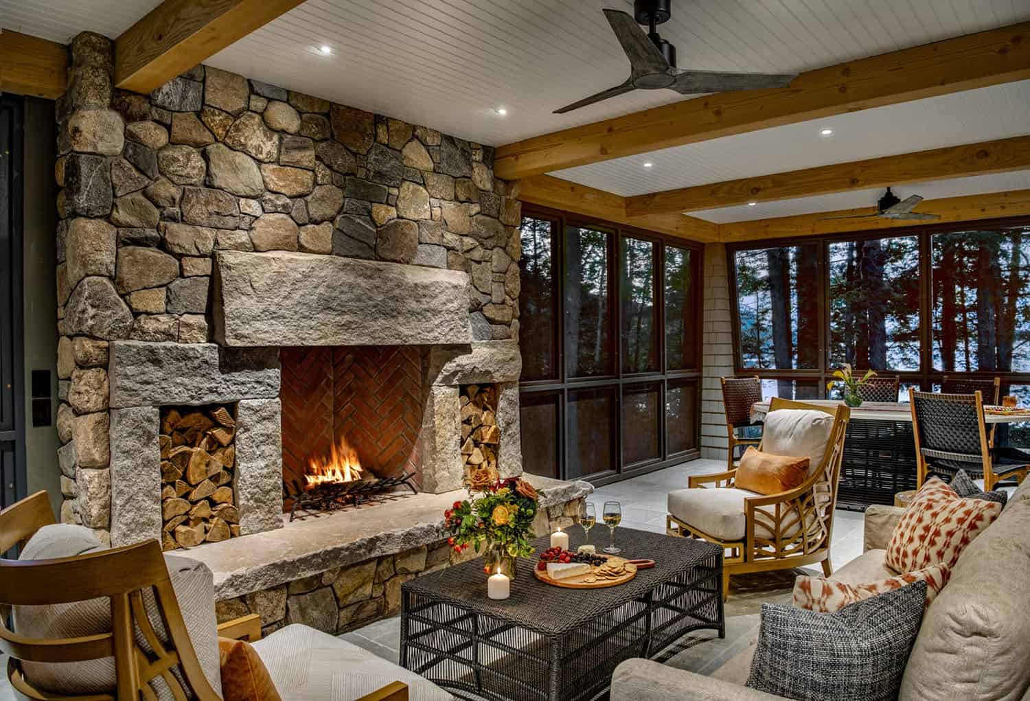 rustc screened porch with a stone fireplace