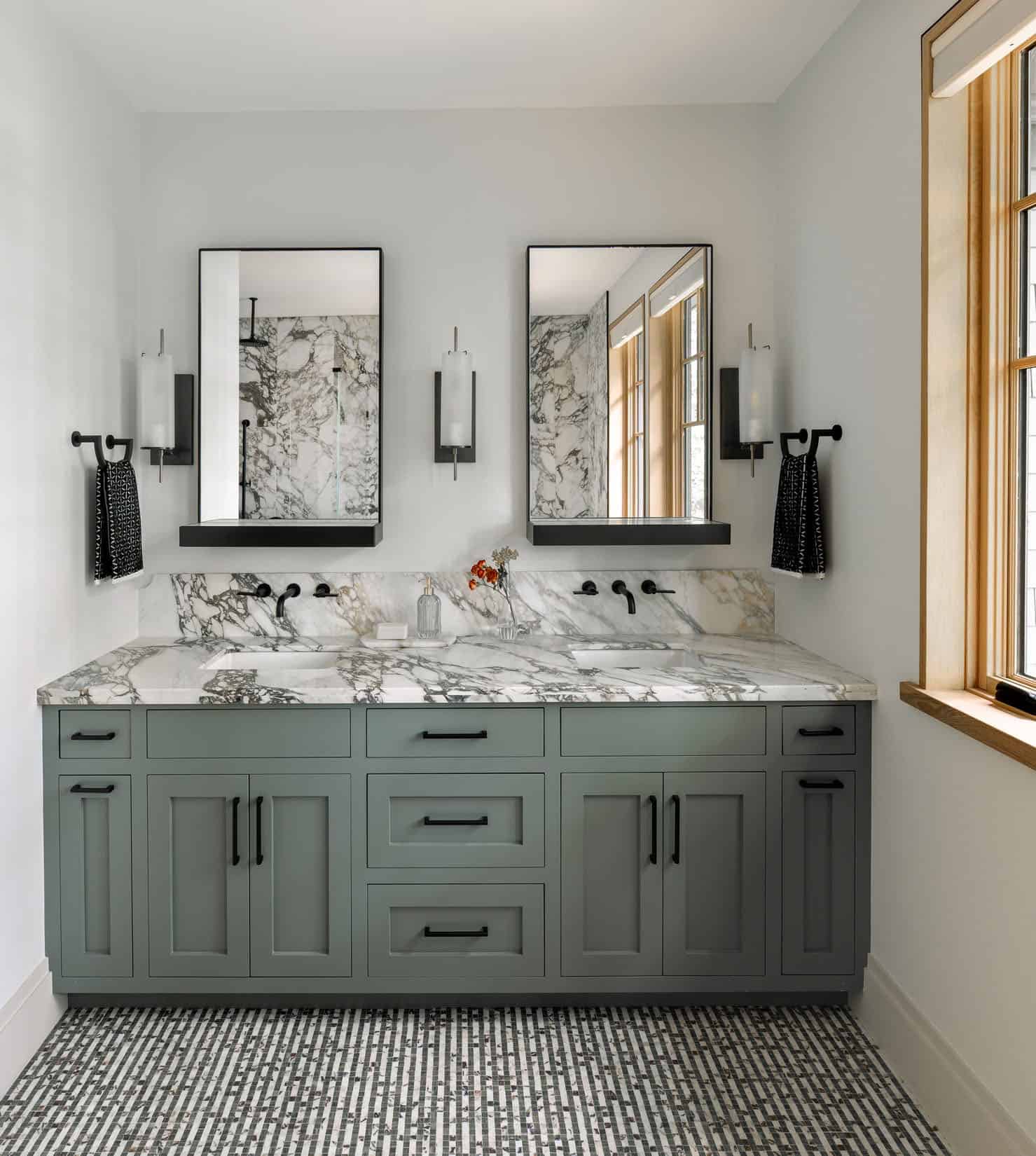 modern bathroom with a dual vanity and mirrors