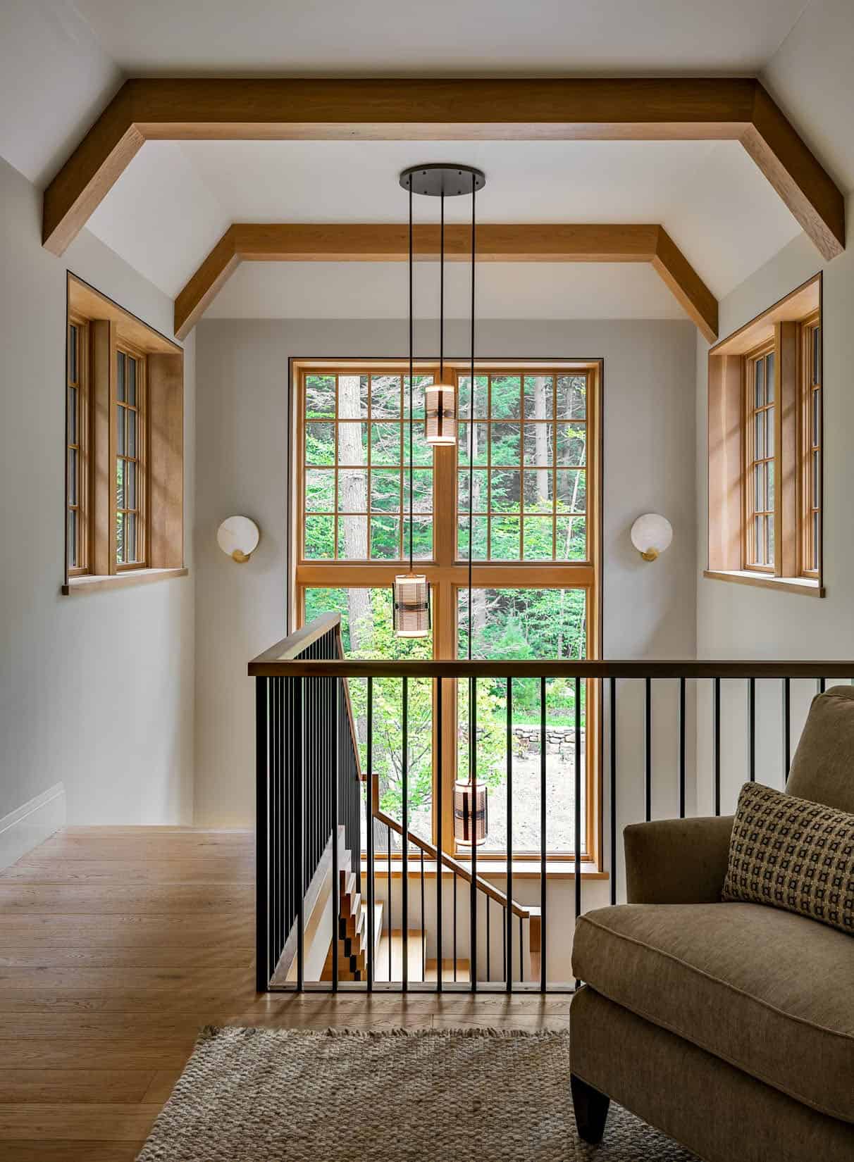 rustic staircase upstairs landing with a chair