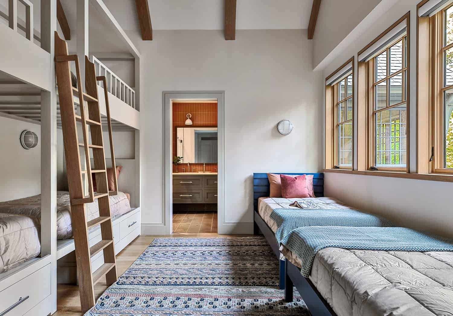 rustic bunk bedroom with a window seat