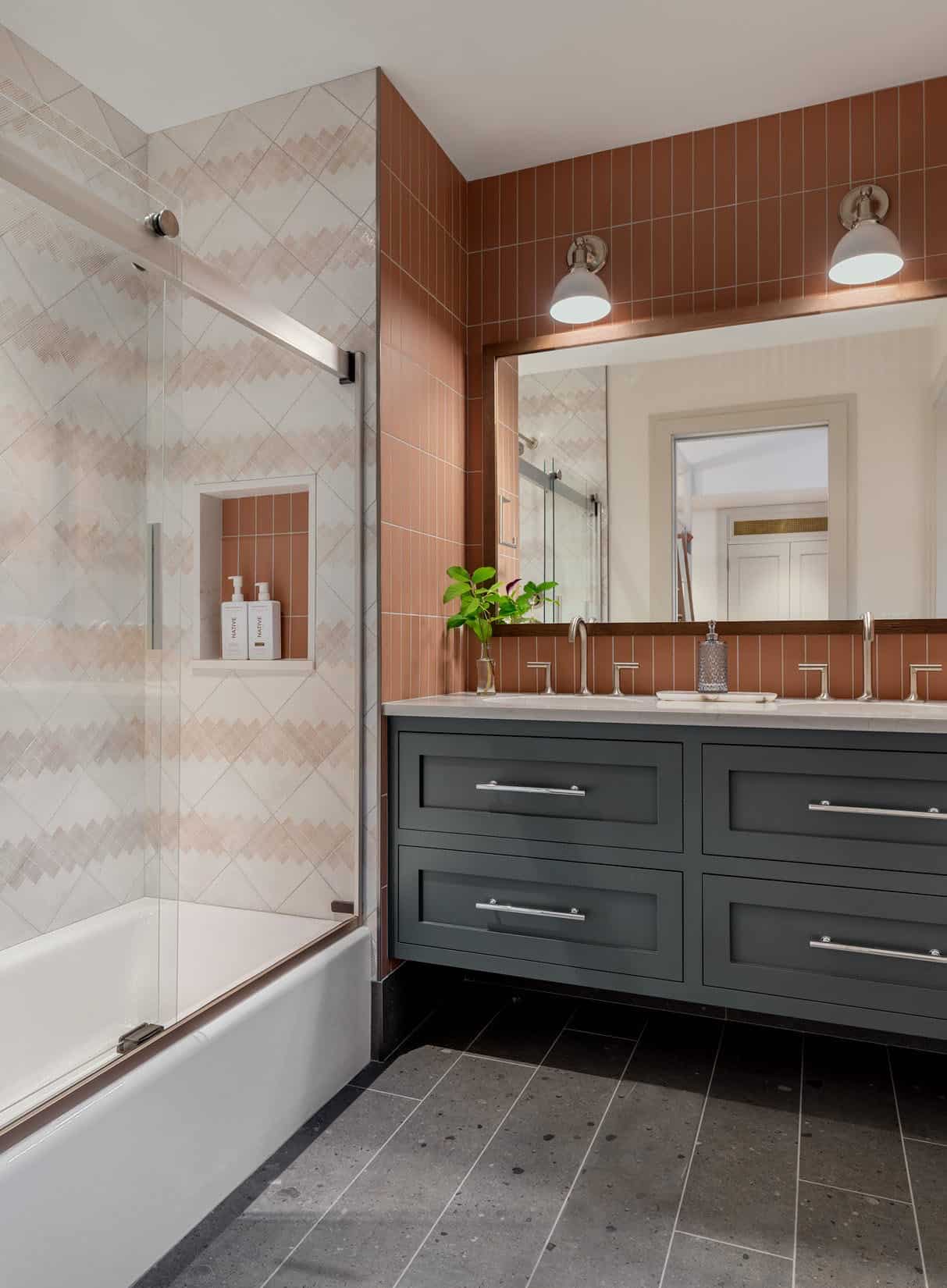 rustic bathroom with a vanity and tub/shower combo