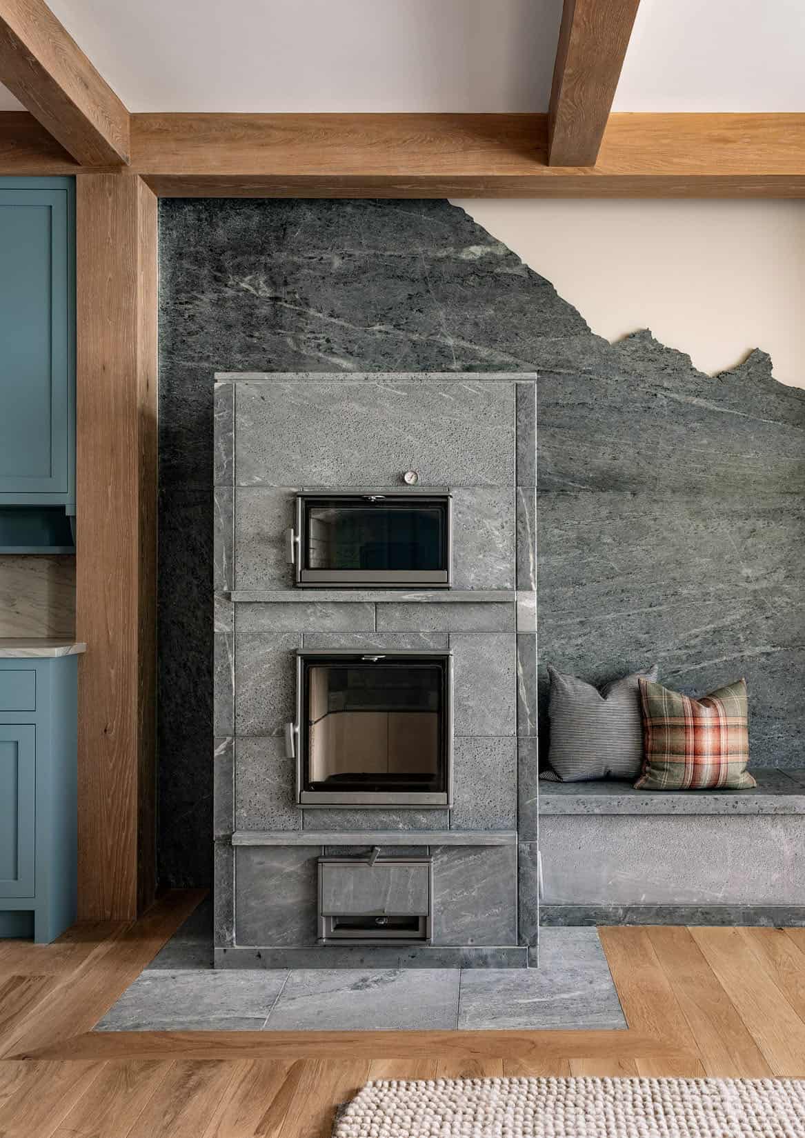 rustic family room with a built-in seat next to a fireplace