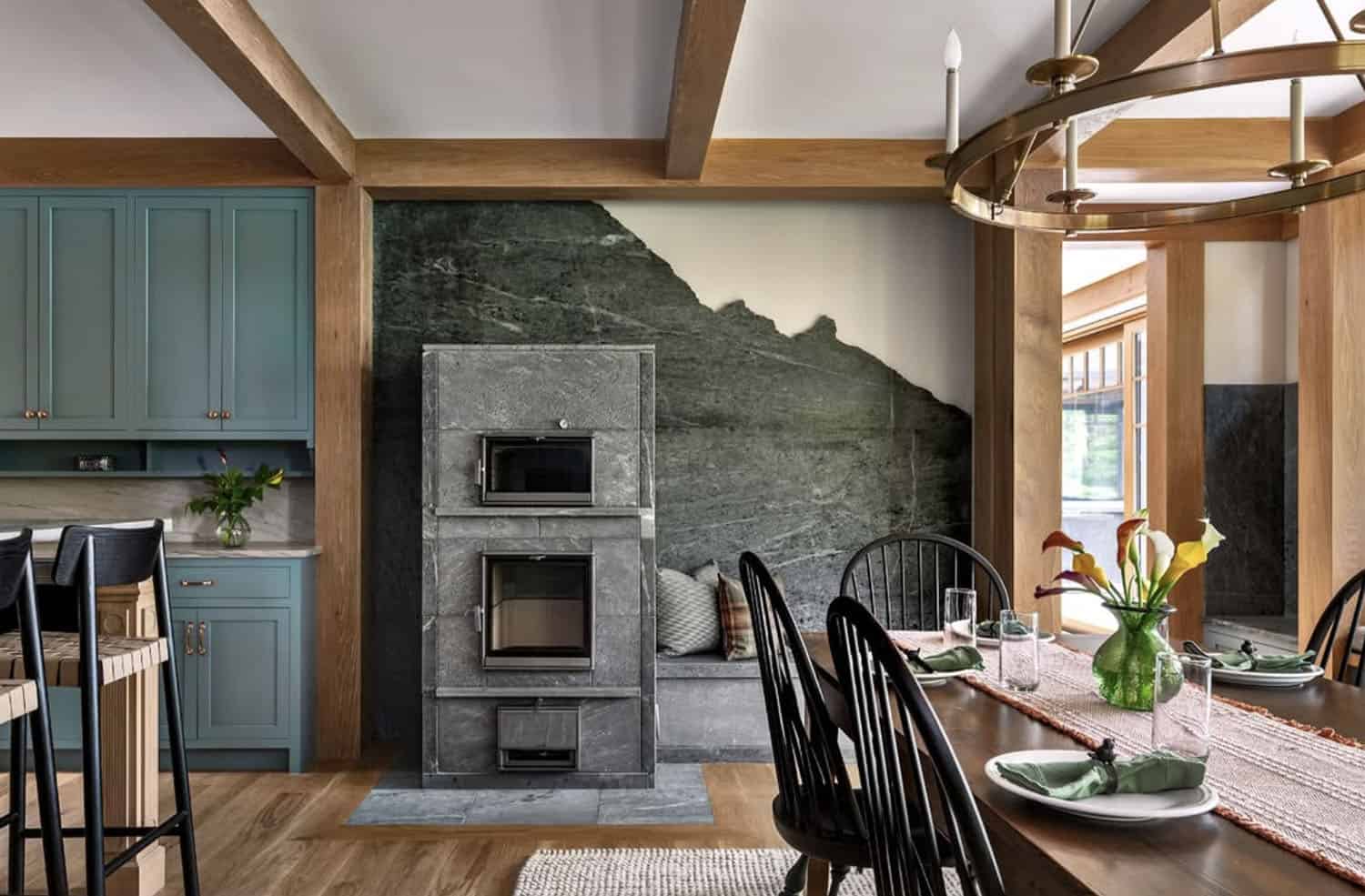 rustic kitchen and dining room with a built-in seat next to a fireplace