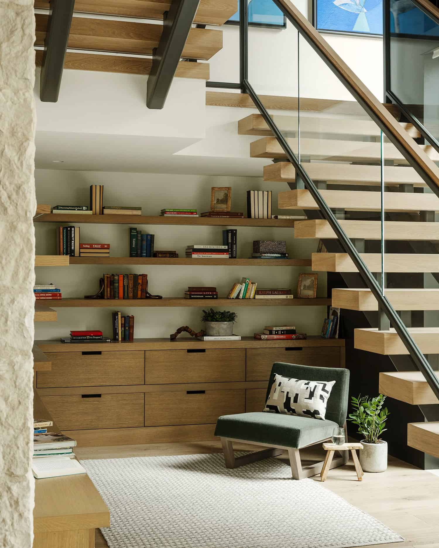 organic modern staircase with a sitting area and built-ins