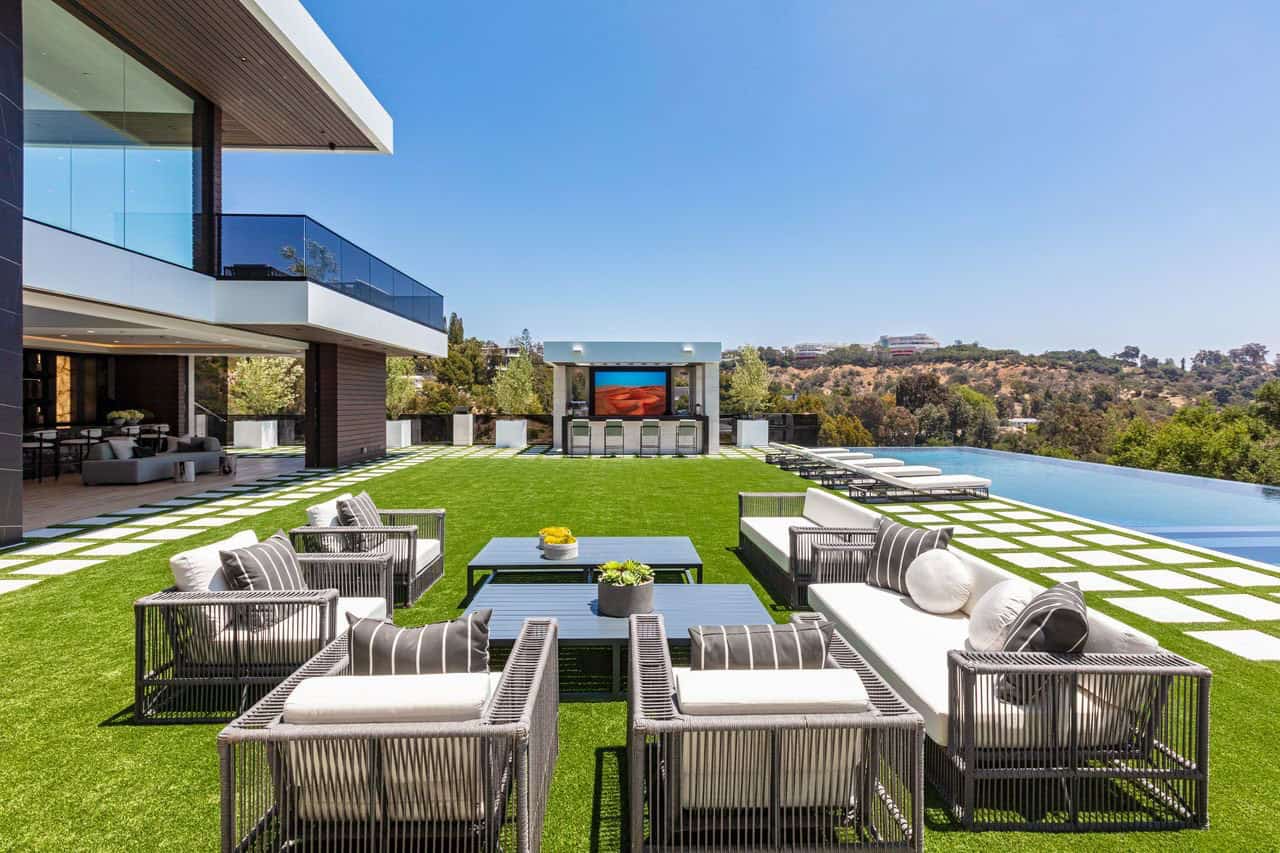 modern house exterior with a patio and outdoor furniture