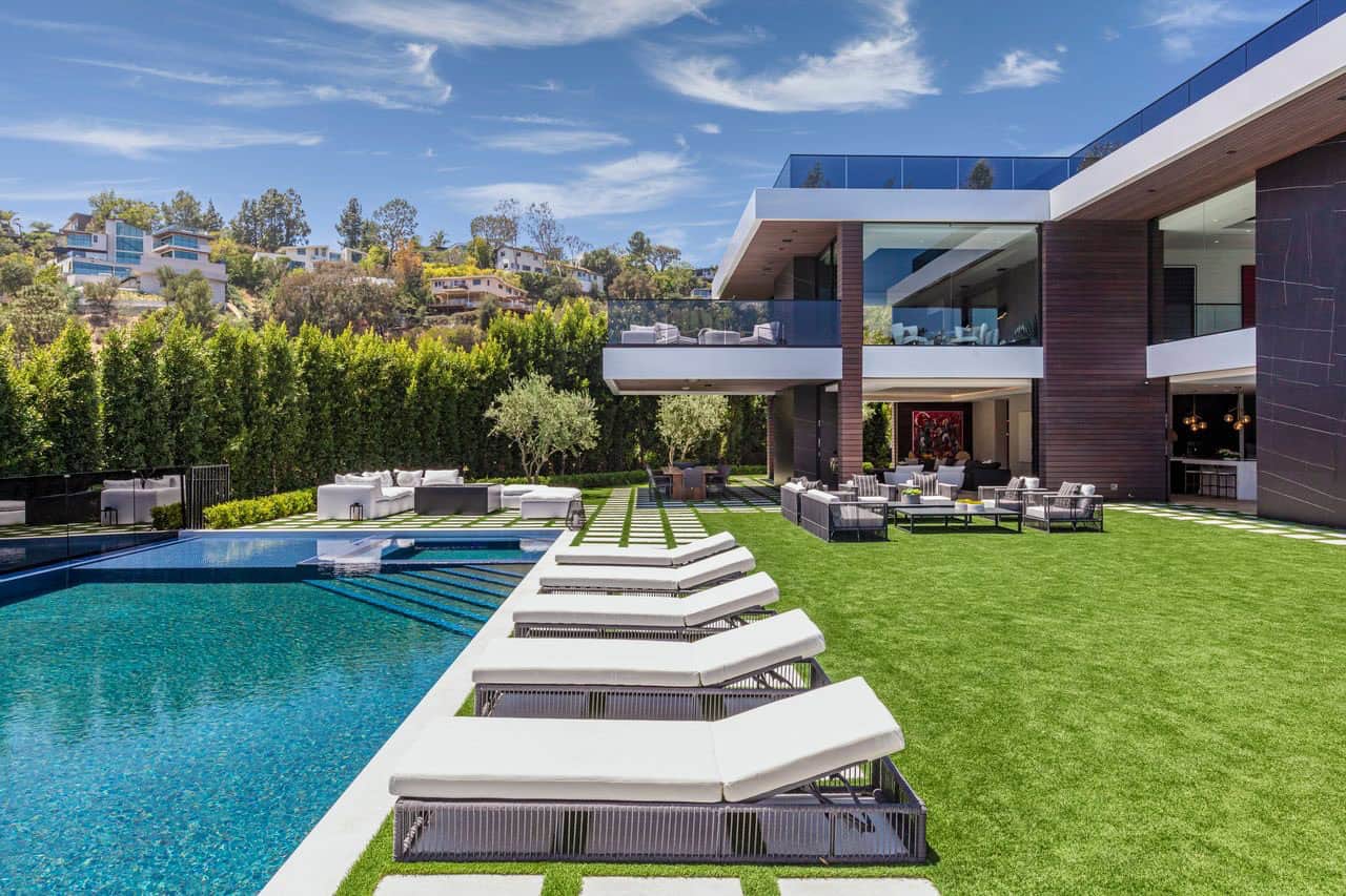 modern house exterior with a patio and pool