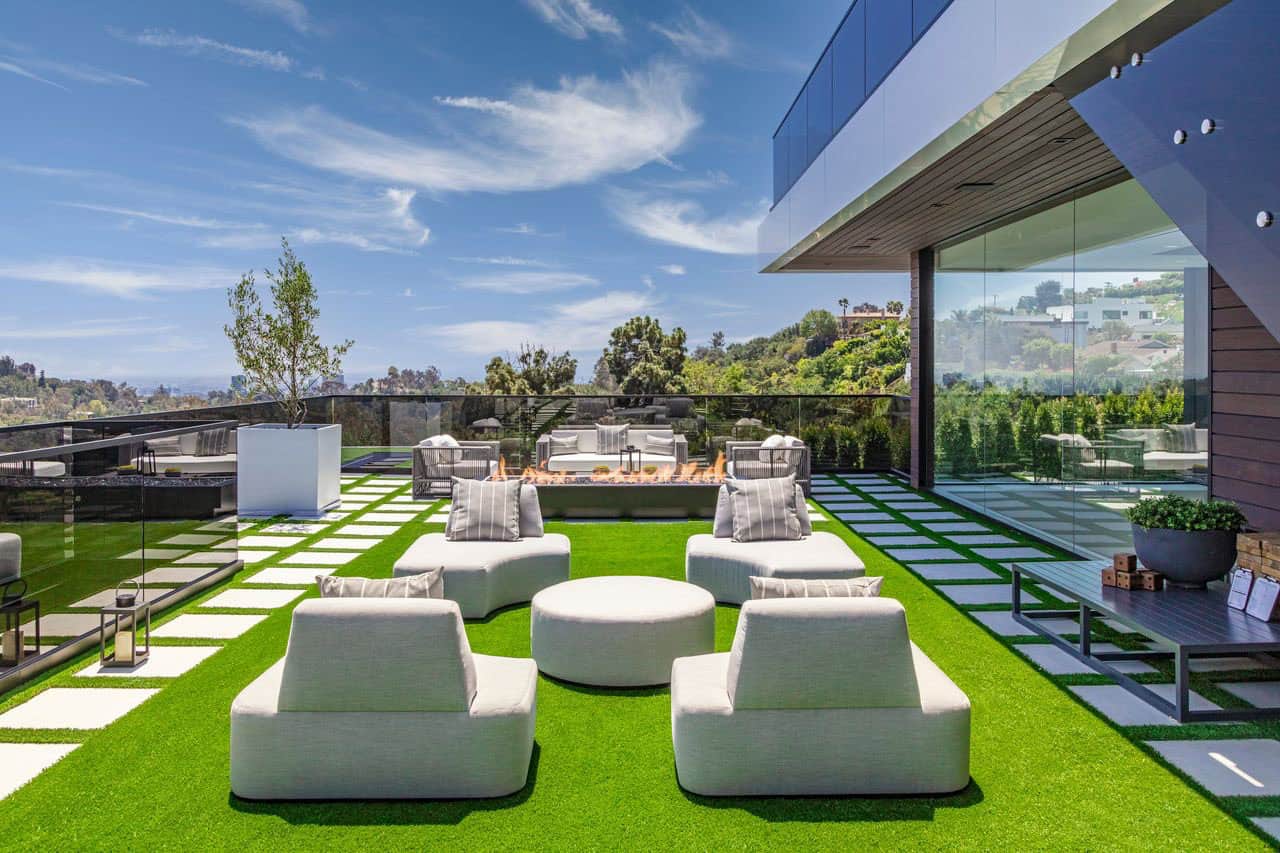 modern house exterior with a patio and outdoor furniture
