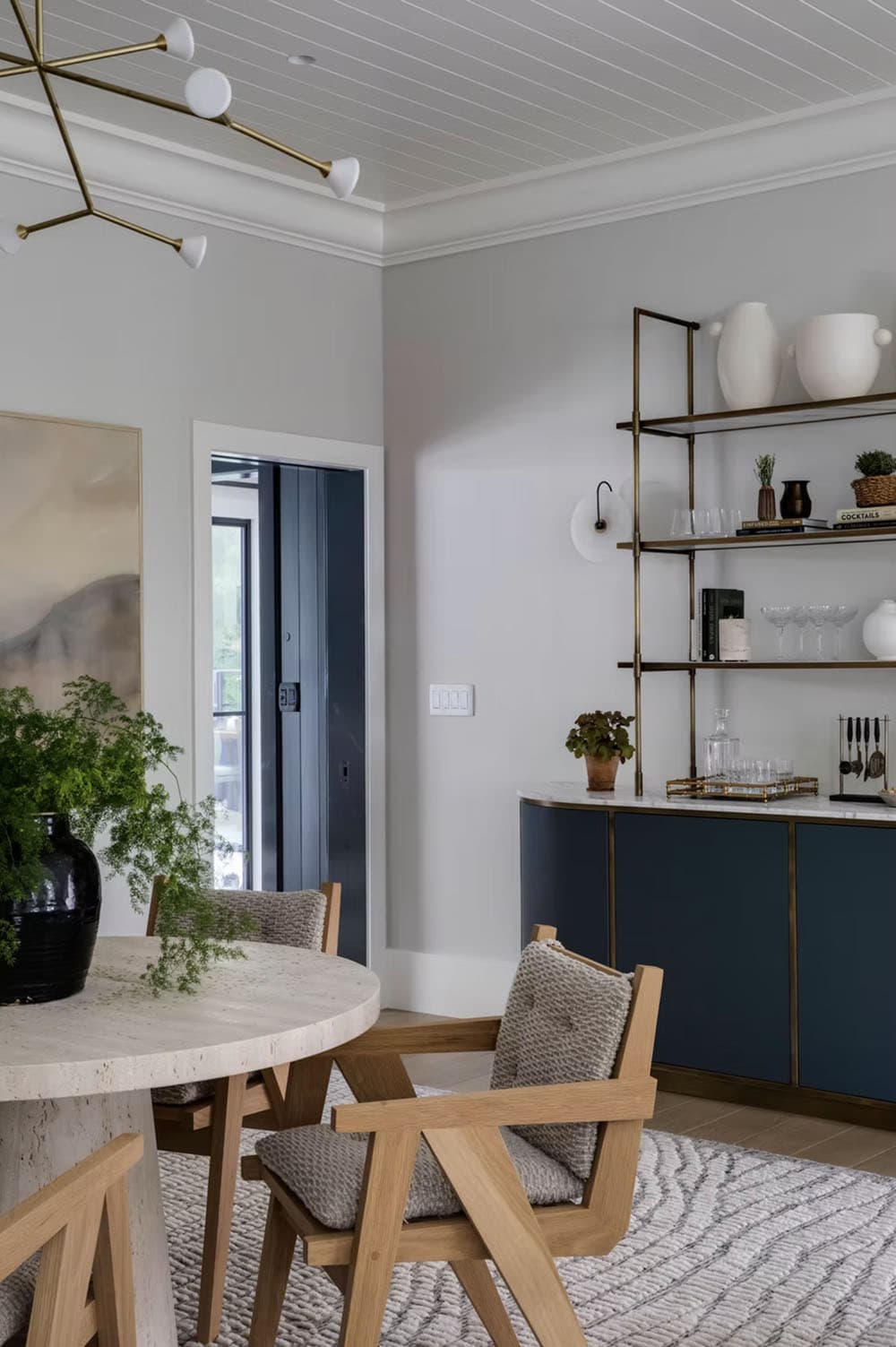 transitional style home bar with a sitting area