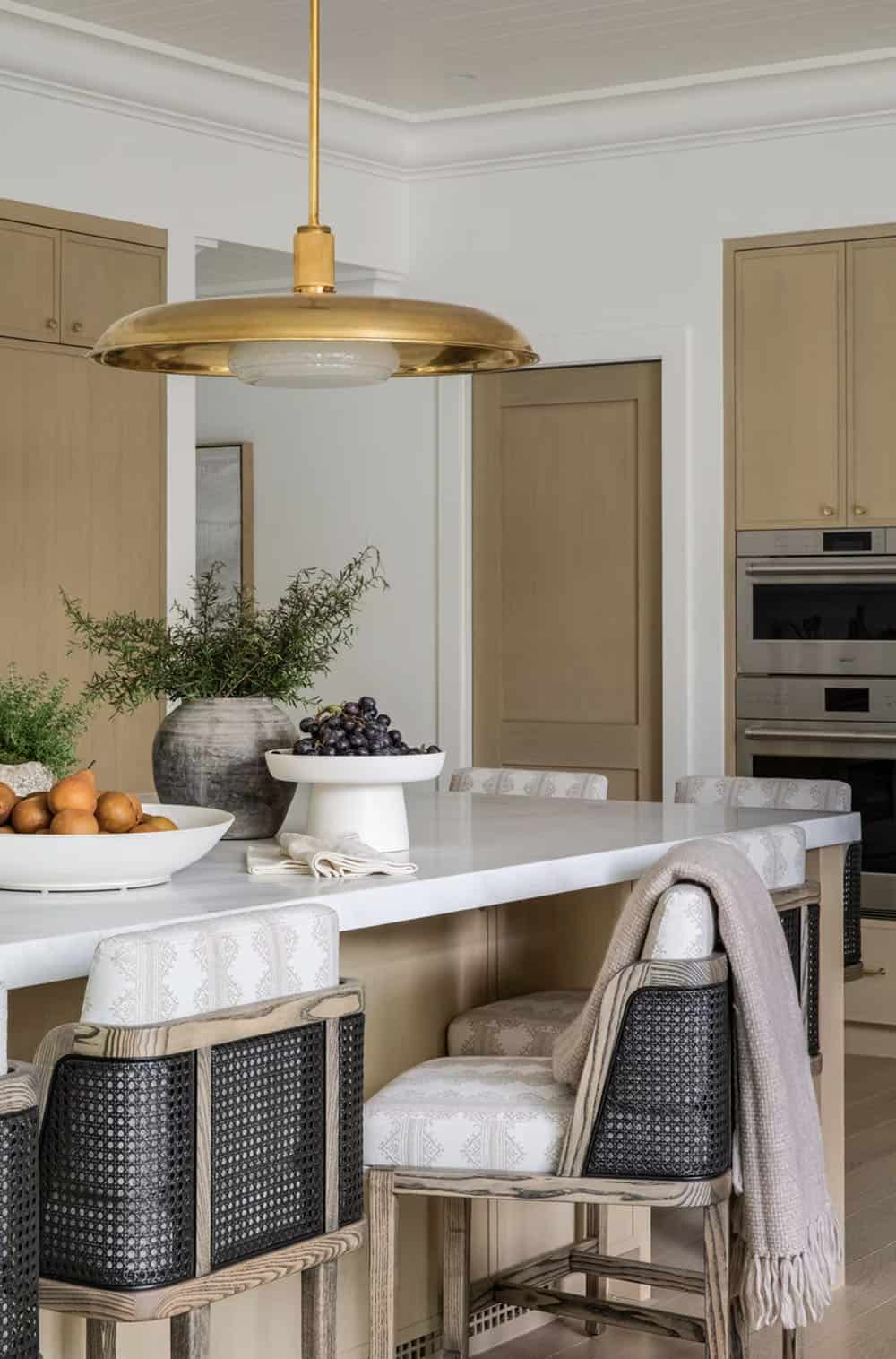 transitional style kitchen with large pendant lights