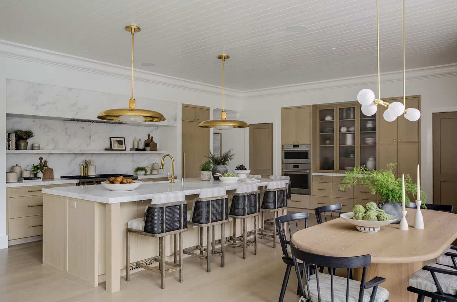 transitional style kitchen with large pendant lights