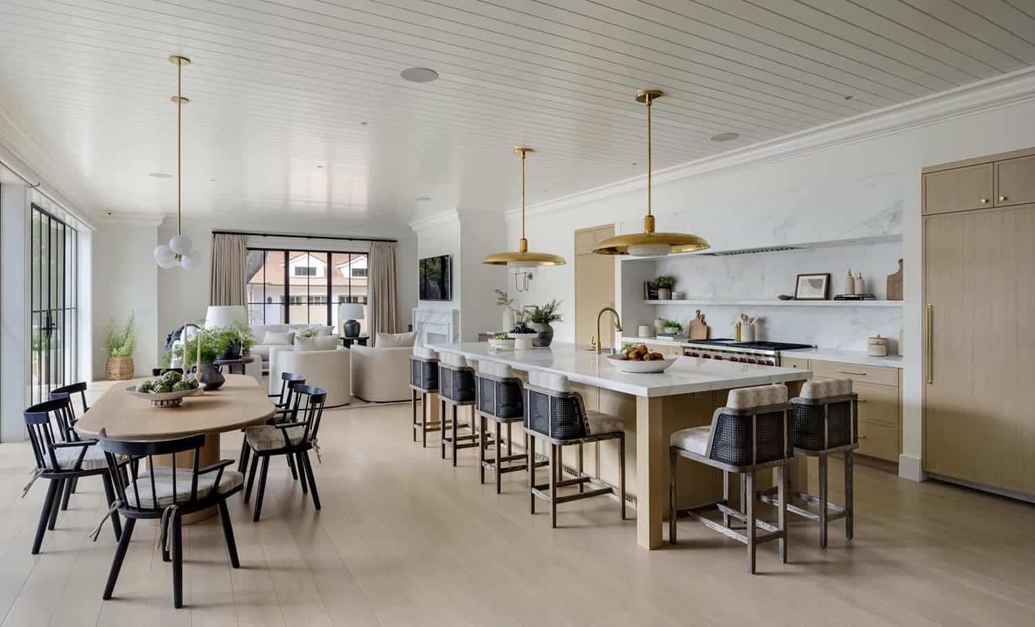 transitional style kitchen with large pendant lights