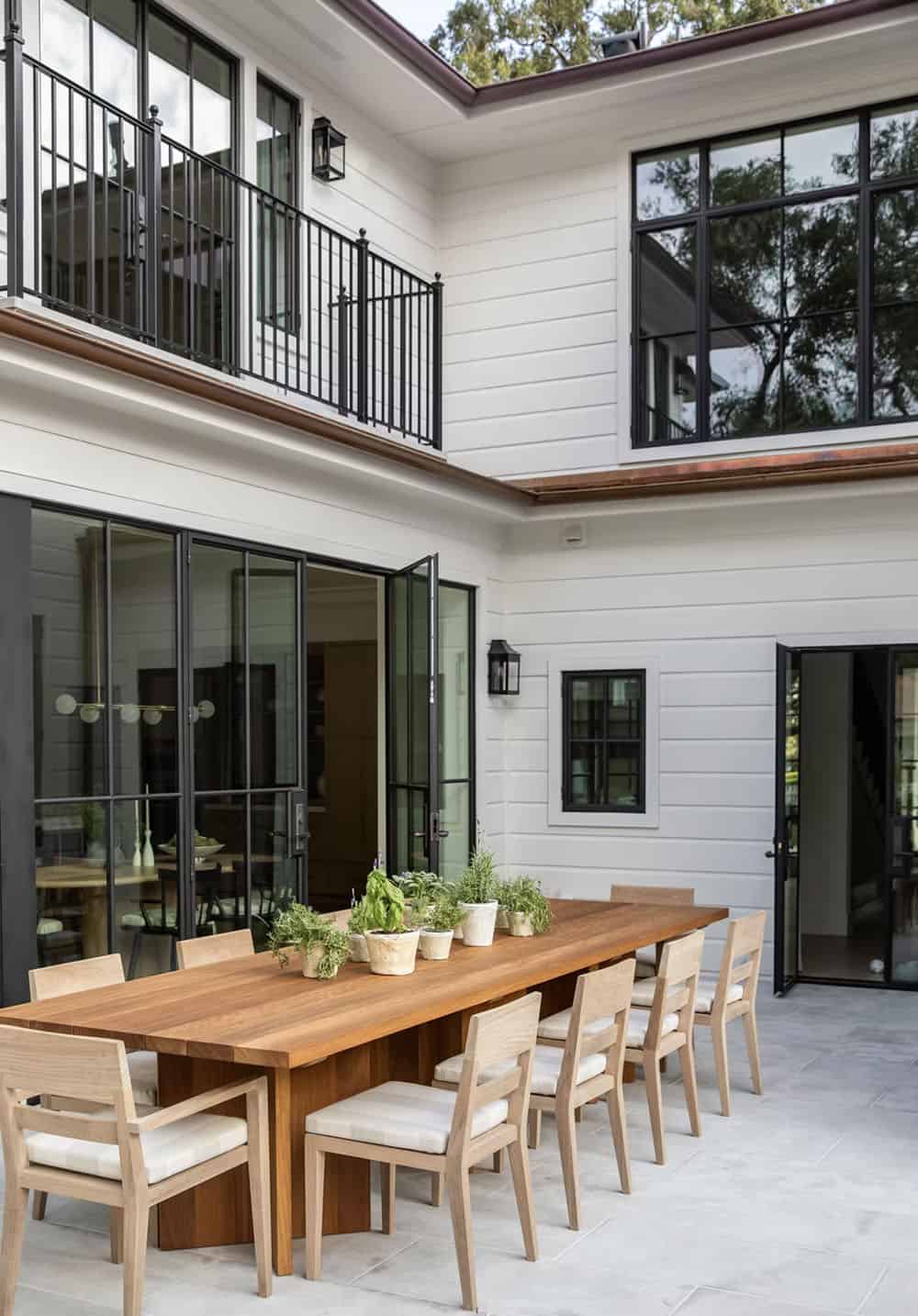 transitional style patio with alfresco dining