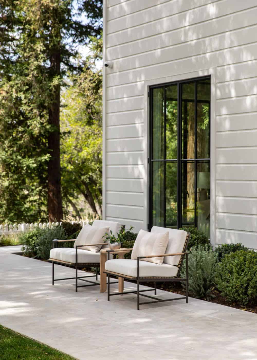southern inspired home exterior with two lounge chairs