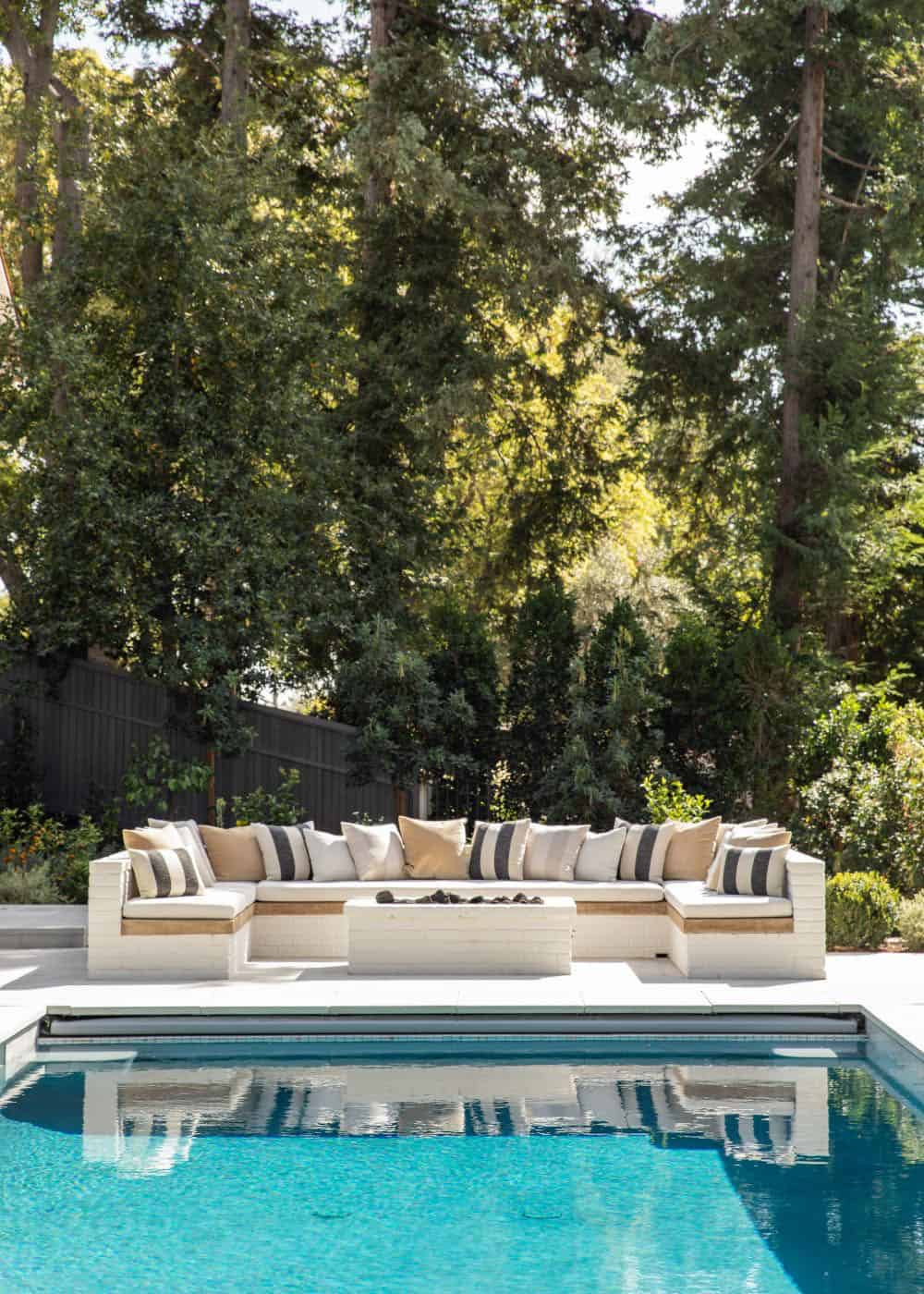 southern inspired home exterior patio with outdoor furniture and a fire pit