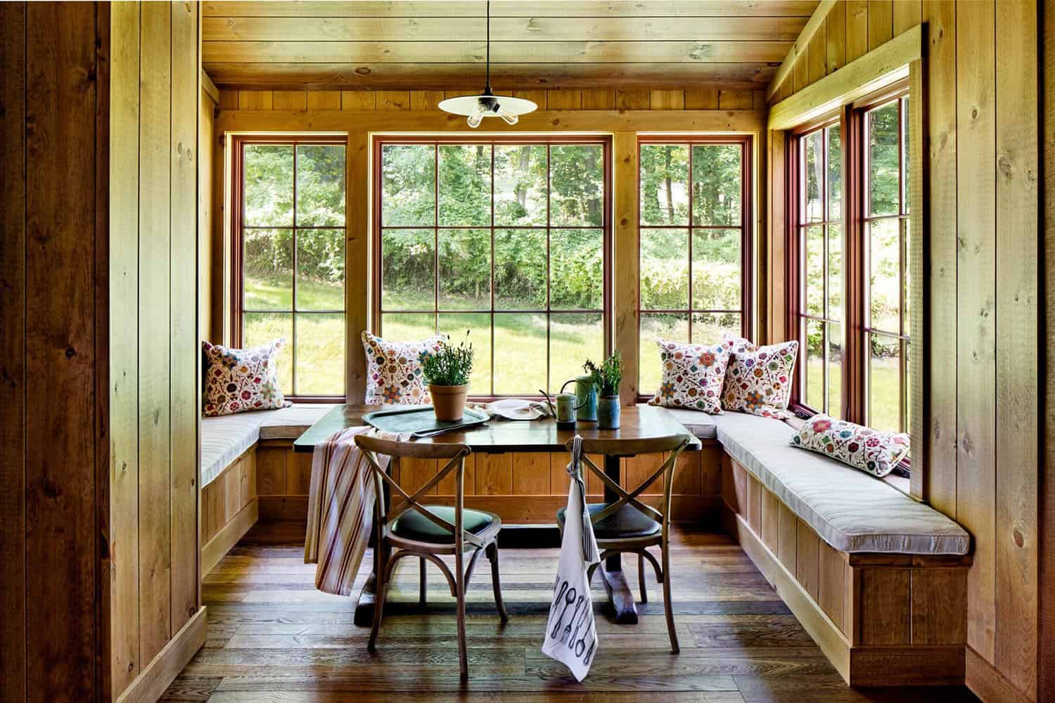 rustic built-in dining banquette with windows