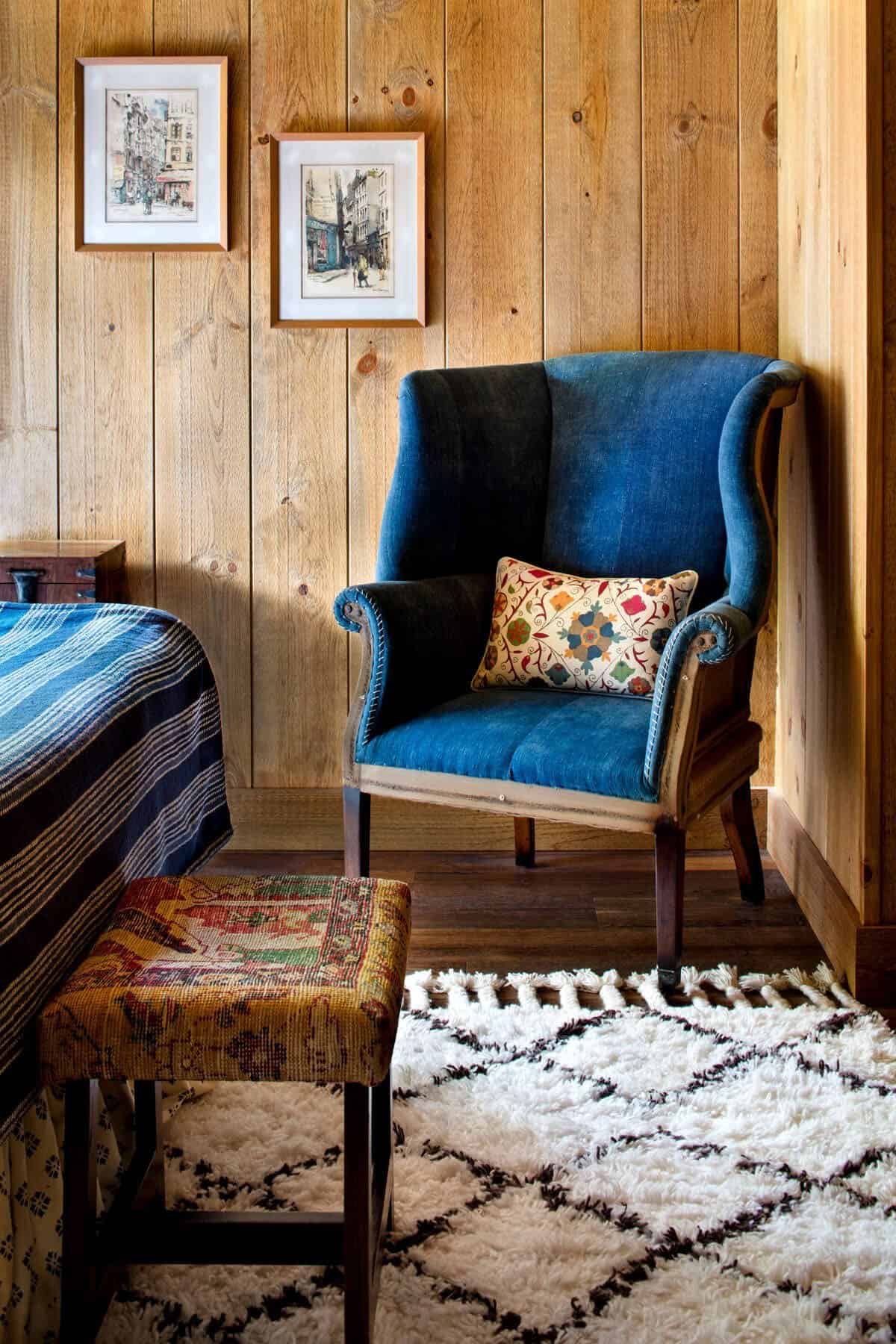 rustic bedroom with a lounge chair