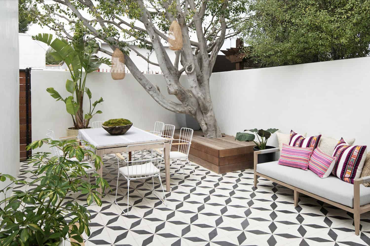 backyard patio with alfresco dining and Spanish-style floor tiles