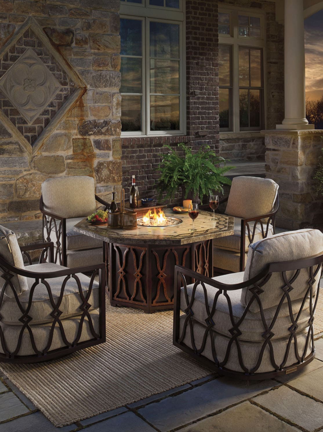 backyard patio with a fire table and seating area