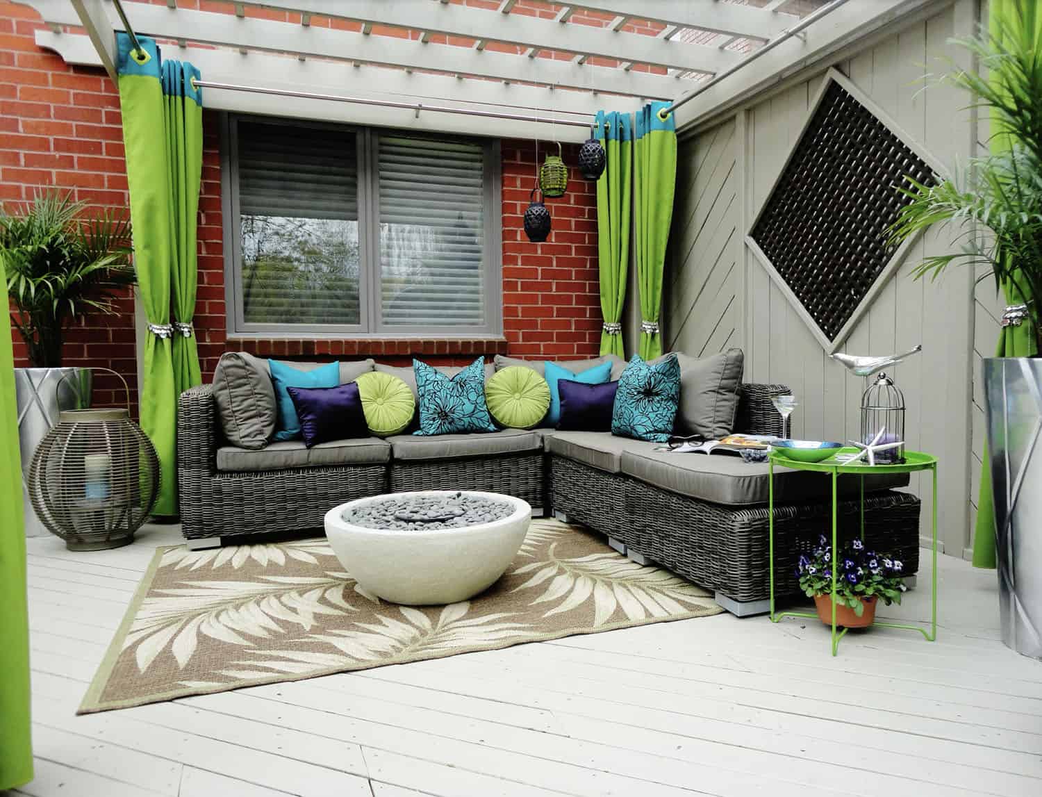 small backyard patio with a sectional and fire pit