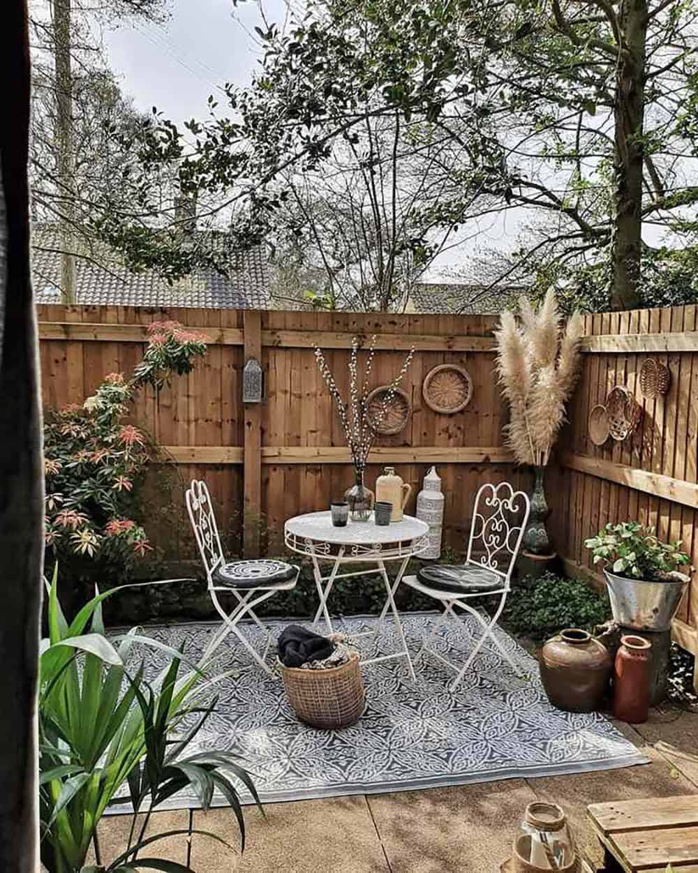 bohemian style patio with a bistro set