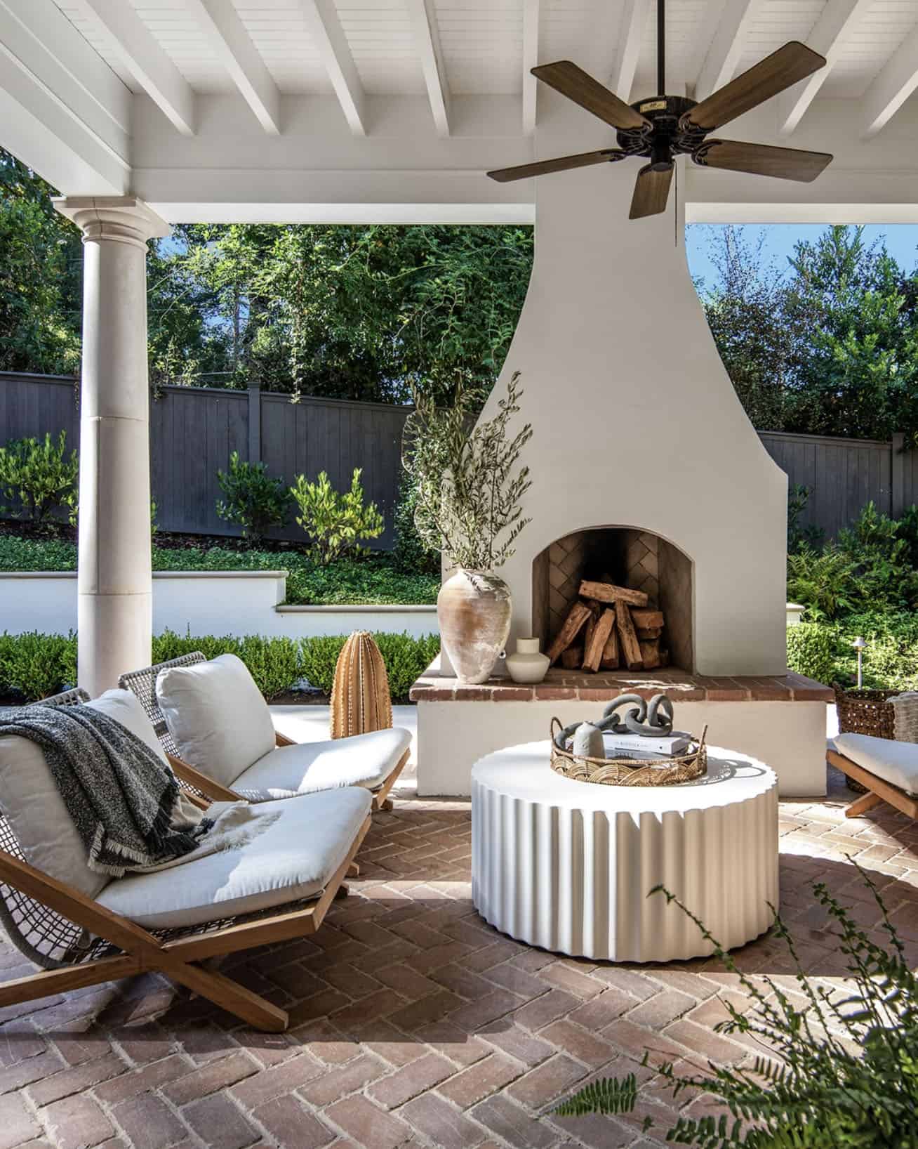 small backyard patio with a fireplace