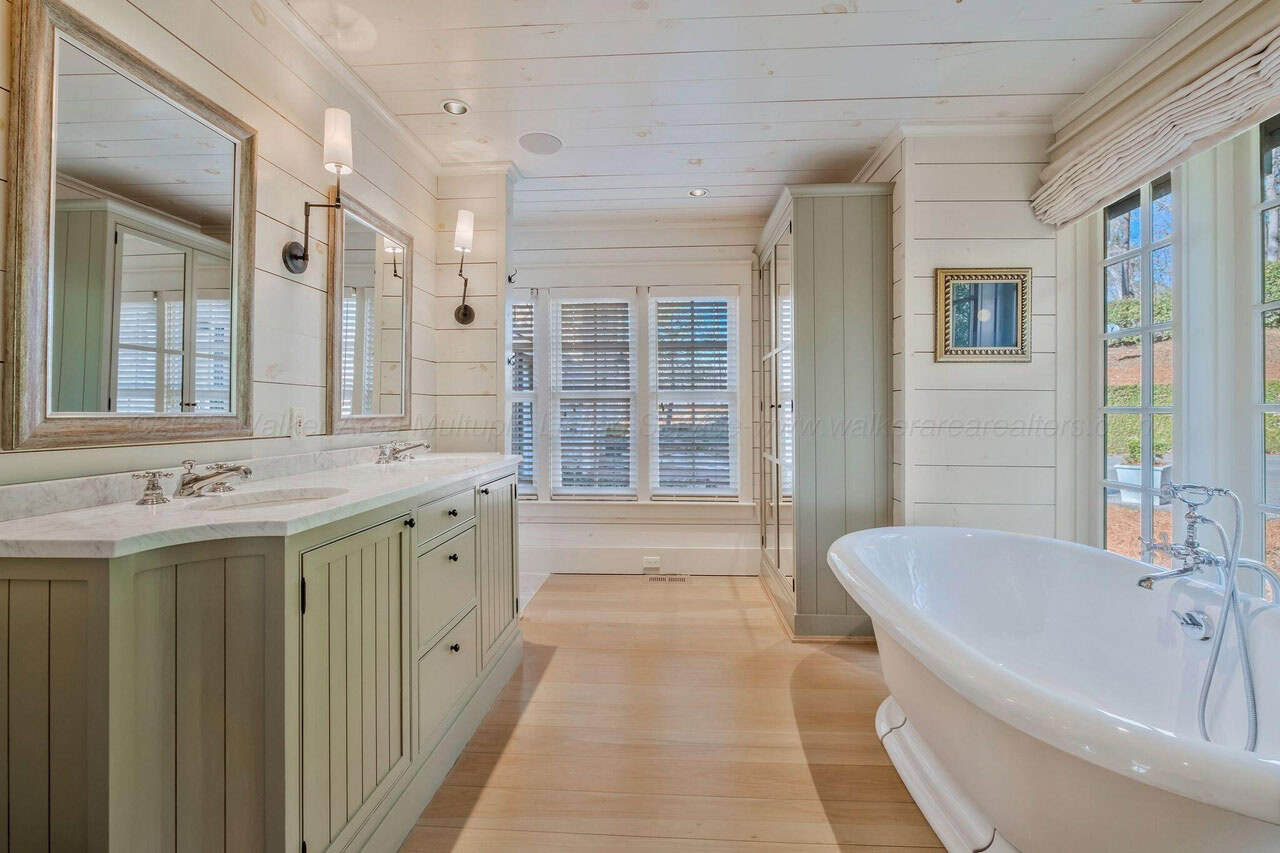 contemporary bathroom with a vanity and freestanding tub