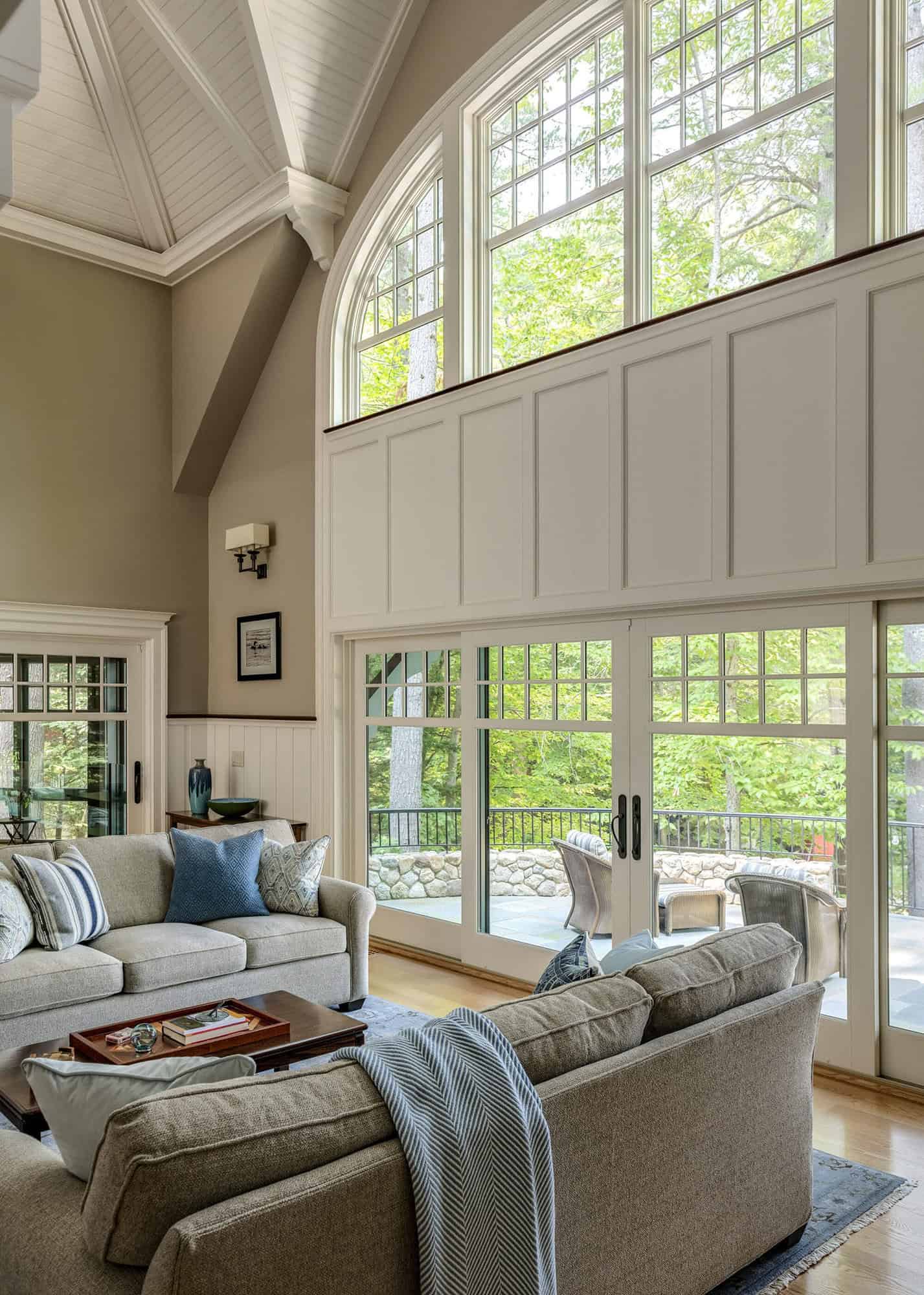 traditional style living room with large windows