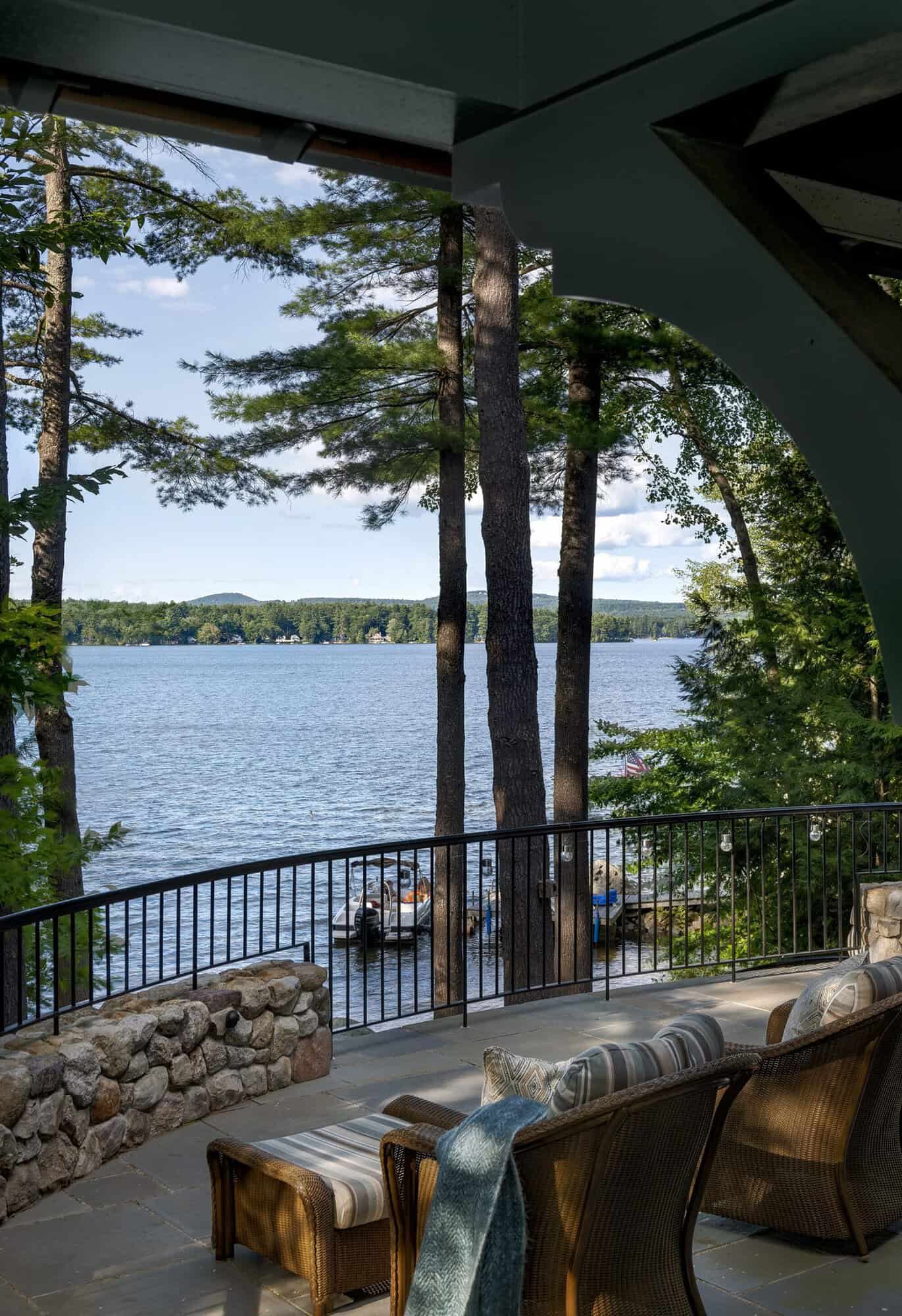 craftsman style lake house exterior with a balcony overlooking the lake