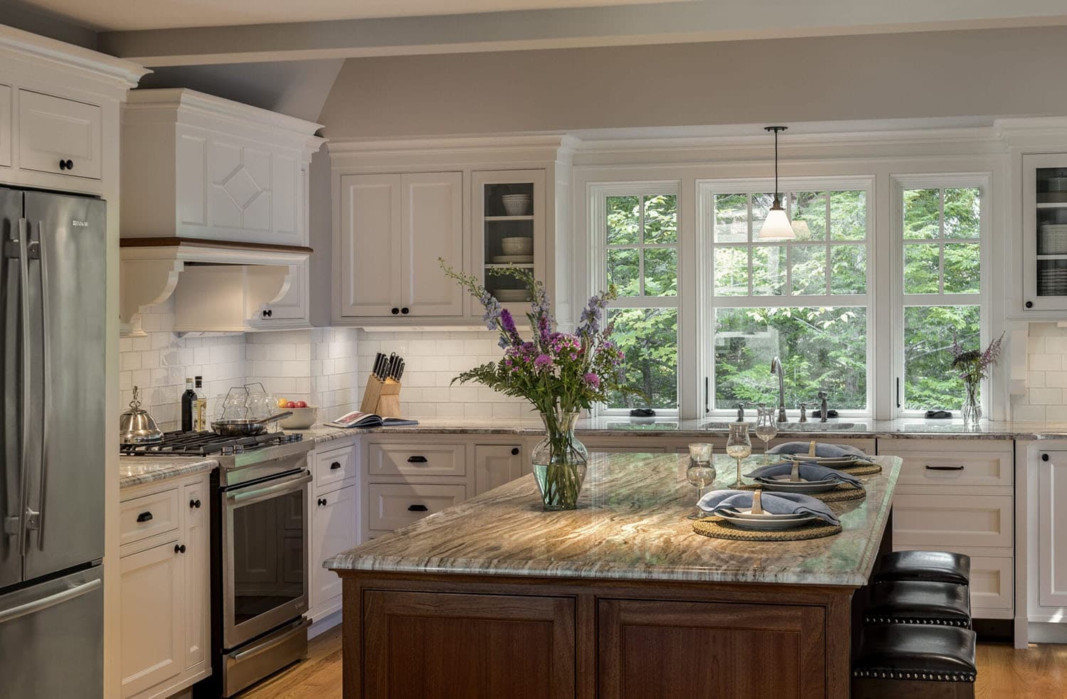 traditional style kitchen with a center island and windows
