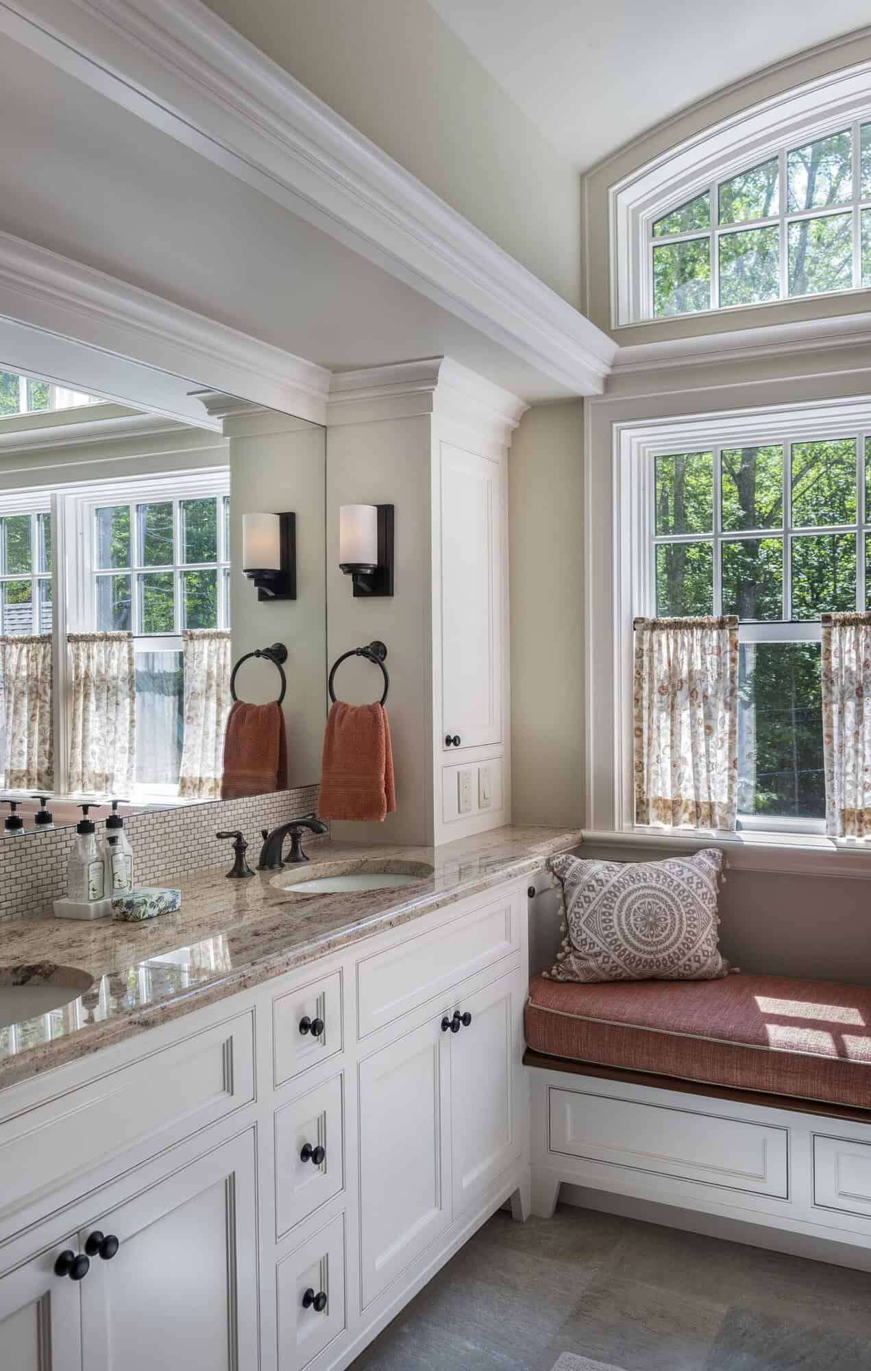 traditional style bathroom with a vanity with a built-in window seat