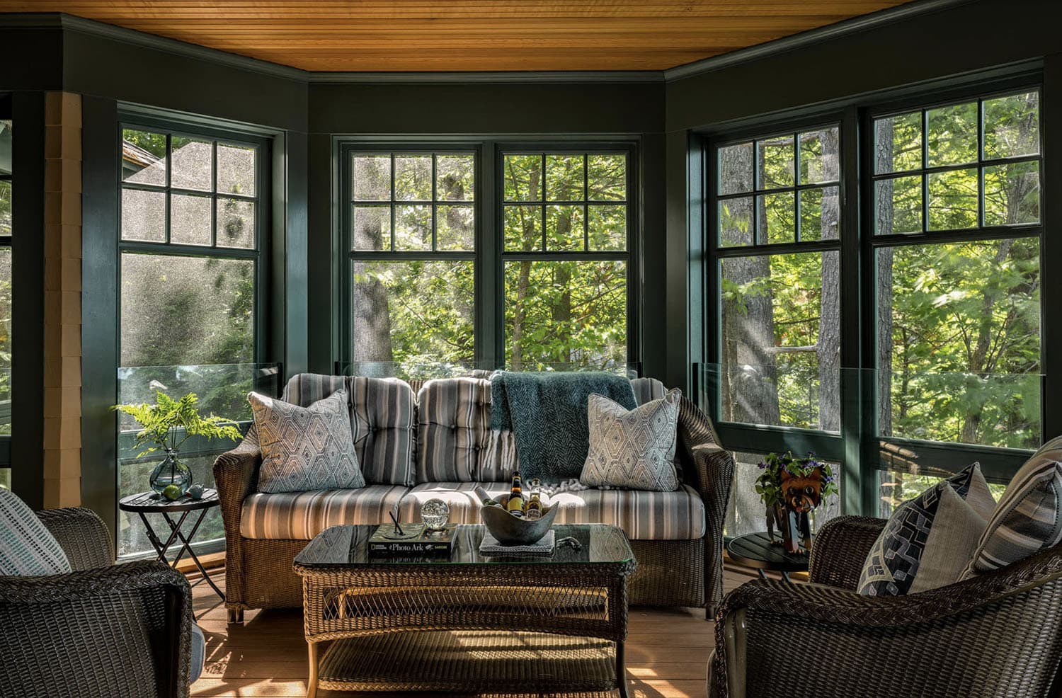 traditional style sunroom with green paint and a wood ceiling