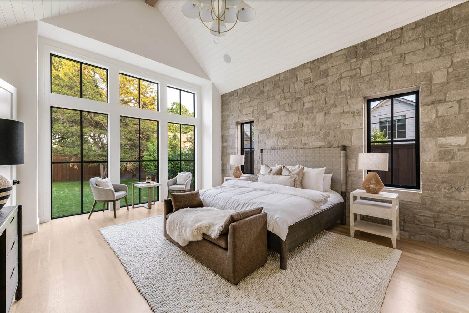 transitional style bedroom with a vaulted ceiling