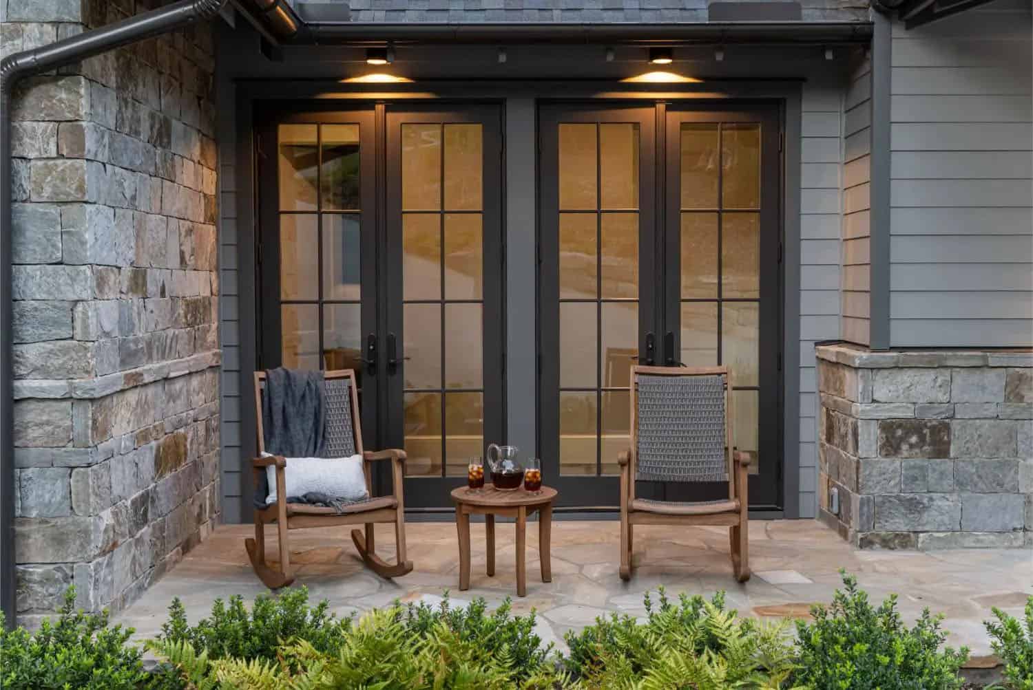 transitional style mountain home exterior backyard view