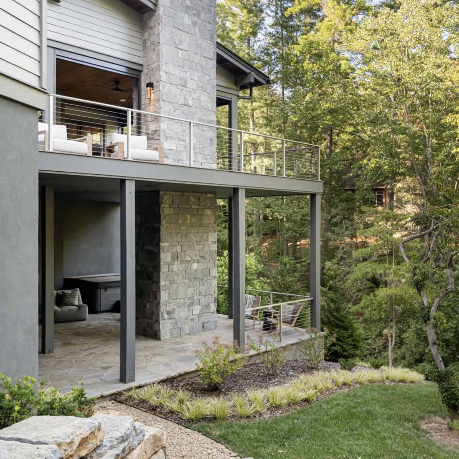 transitional style mountain home exterior backyard view