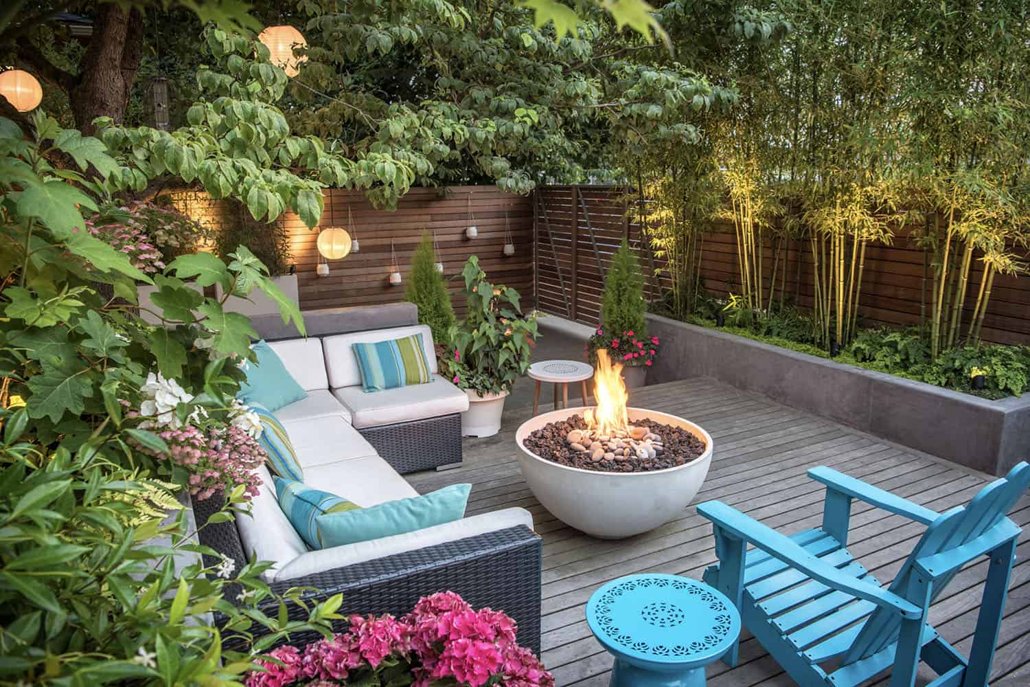 deck with outdoor furniture, a fire pit, and outdoor lighting