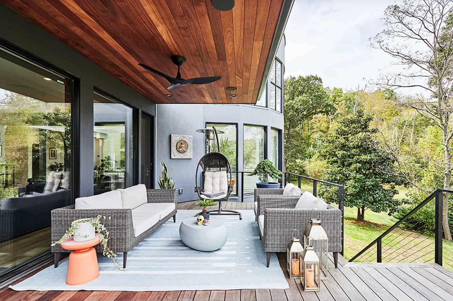 contemporary deck with outdoor furniture and an area rug