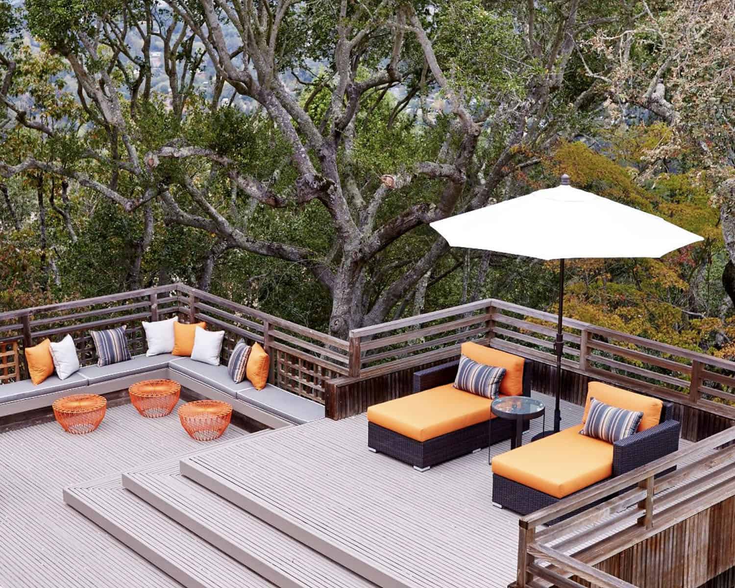 midcentury deck with chaise lounges and an umbrella