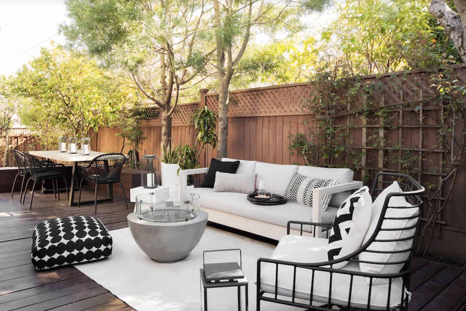 contemporary deck with outdoor furniture and a fire pit