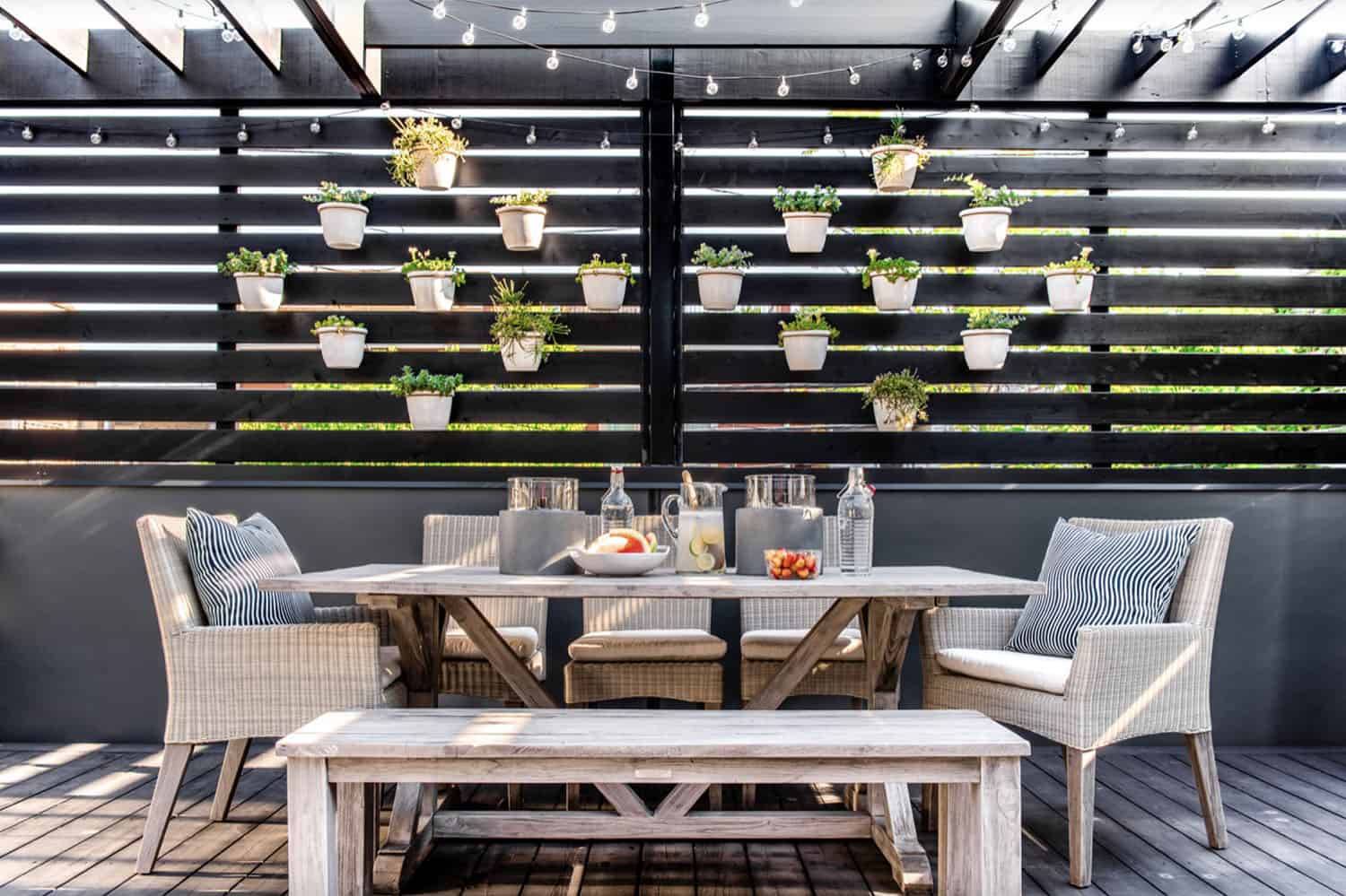 contemporary deck with alfresco dining and a privacy screen